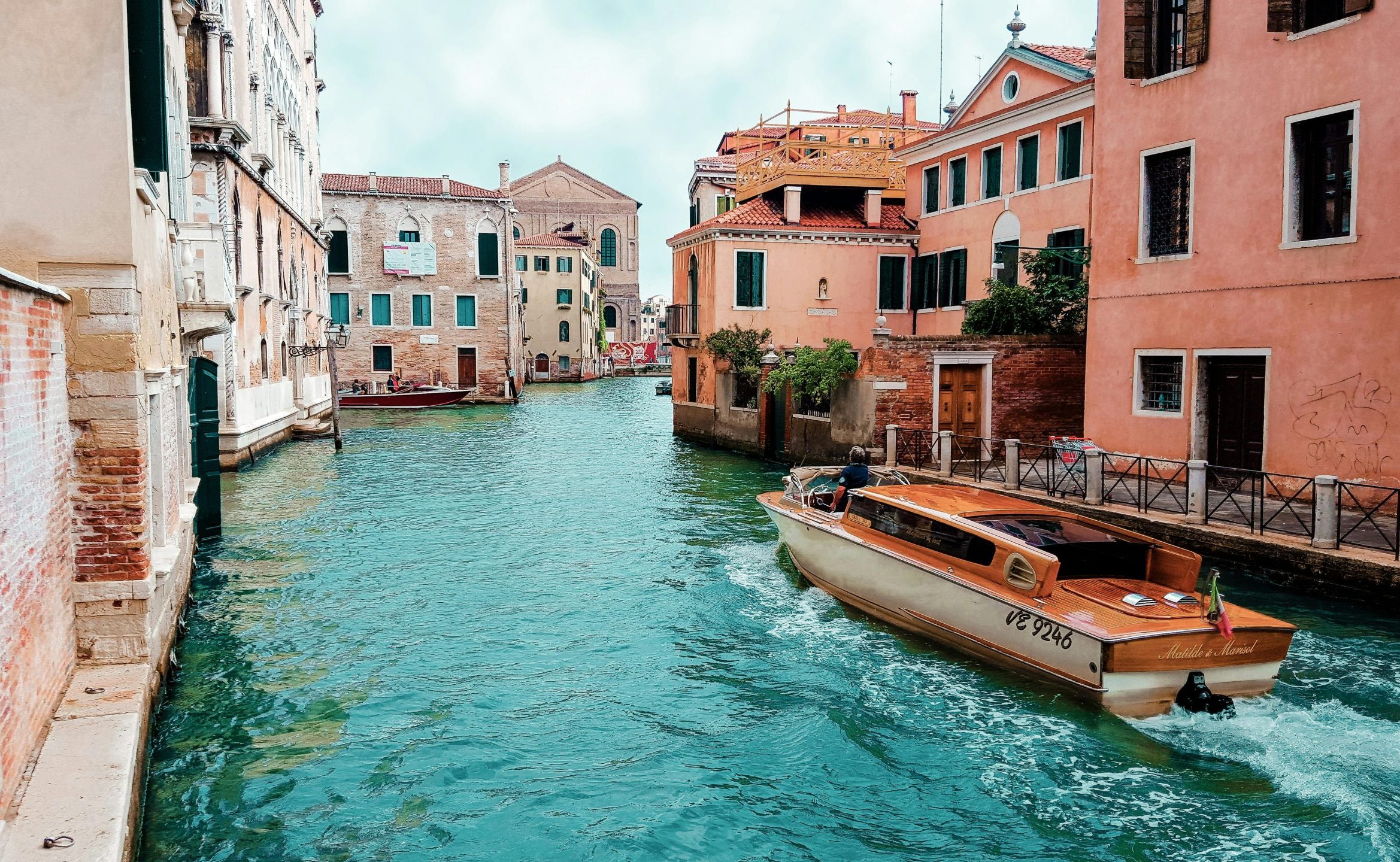Picturesque view of Venice's canals with charming architecture and traditional boat.
